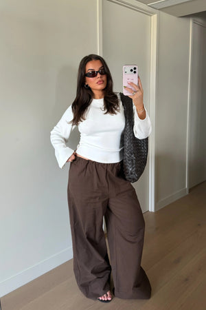 Jaz Mid Rise Relaxed Suit Pant in Chocolate with a mid rise waist and straight leg fit, creating a relaxed, fluid silhouette with a soft, tailored finish.