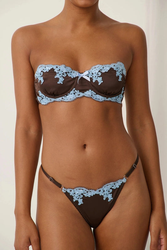 Jean Thong Espresso by Kat the Label – satin thong with blue lace trim and adjustable waistband.