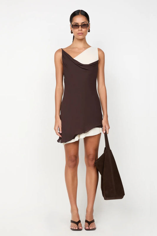 Jehnaya Asym Mini Dress by Bec + Bridge, an asymmetric dual-tone mini with cowl neckline, knotted shoulder, and mesh contrast for modern allure.