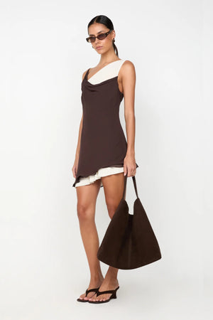 Jehnaya Asym Mini Dress by Bec + Bridge, an asymmetric dual-tone mini with cowl neckline, knotted shoulder, and mesh contrast for modern allure.