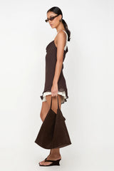 Jehnaya Asym Mini Dress by Bec + Bridge, an asymmetric dual-tone mini with cowl neckline, knotted shoulder, and mesh contrast for modern allure.