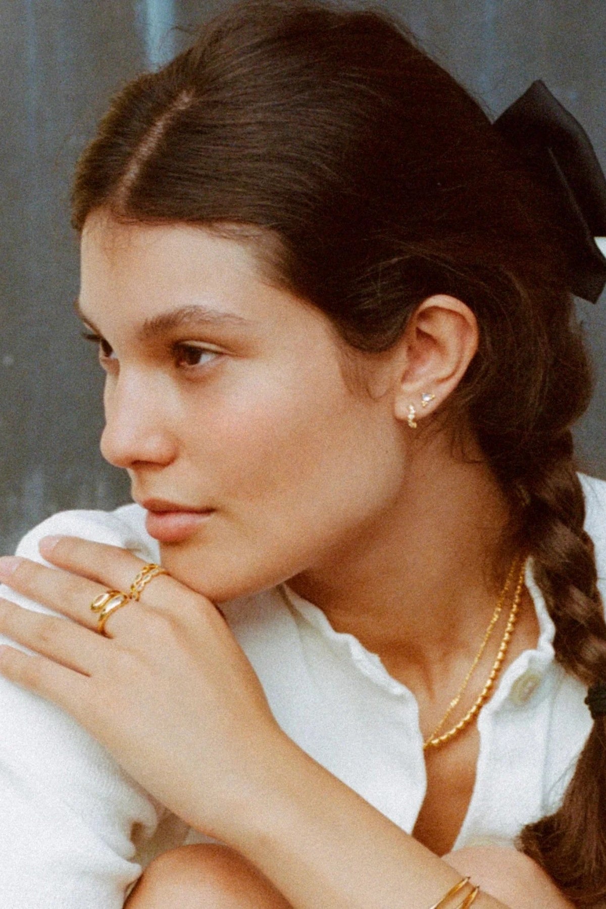 Jemima Huggies by Avant Studio, dainty gold hoops with pastel CZ gems. Perfect for subtle ear stacks and everyday styling.