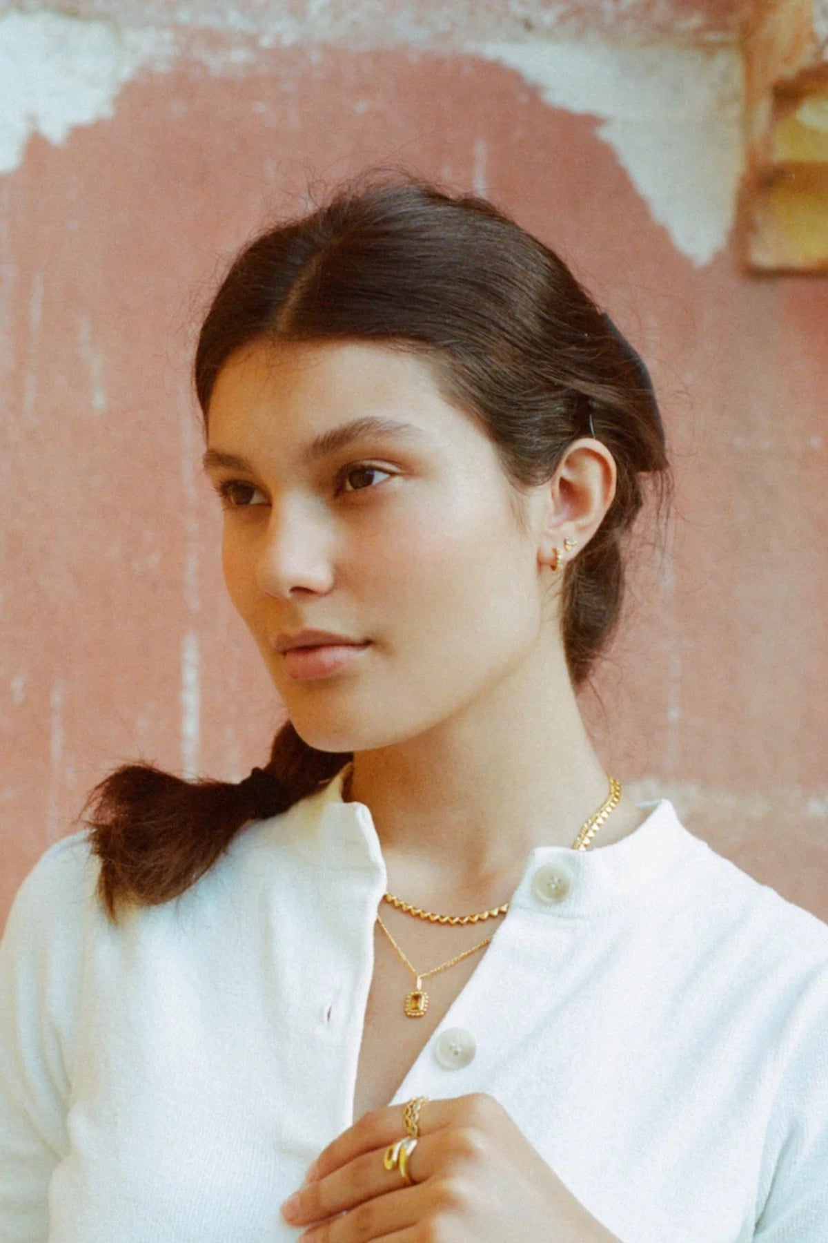 Jemima Huggies by Avant Studio, dainty gold hoops with pastel CZ gems. Perfect for subtle ear stacks and everyday styling.