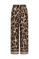 Jensen Pant in Ombra by Faithfull the Brand, a mid-rise satin pant with elasticated waist, wide straight leg, and animal print finish.