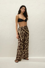 Jensen Pant in Ombra by Faithfull the Brand, a mid-rise satin pant with elasticated waist, wide straight leg, and animal print finish.