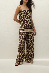 Jensen Pant in Ombra by Faithfull the Brand, a mid-rise satin pant with elasticated waist, wide straight leg, and animal print finish.