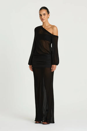 Jessa Long Sleeve Maxi Dress in Black by Benni, a sheer chiffon off-shoulder maxi with bell sleeves and a ruched hip panel.