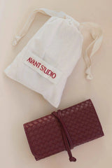 Jewellery Roll Plum by Avant Studio, cross-hatch faux leather with organized pouches. Perfect for stylish travel and gifting.