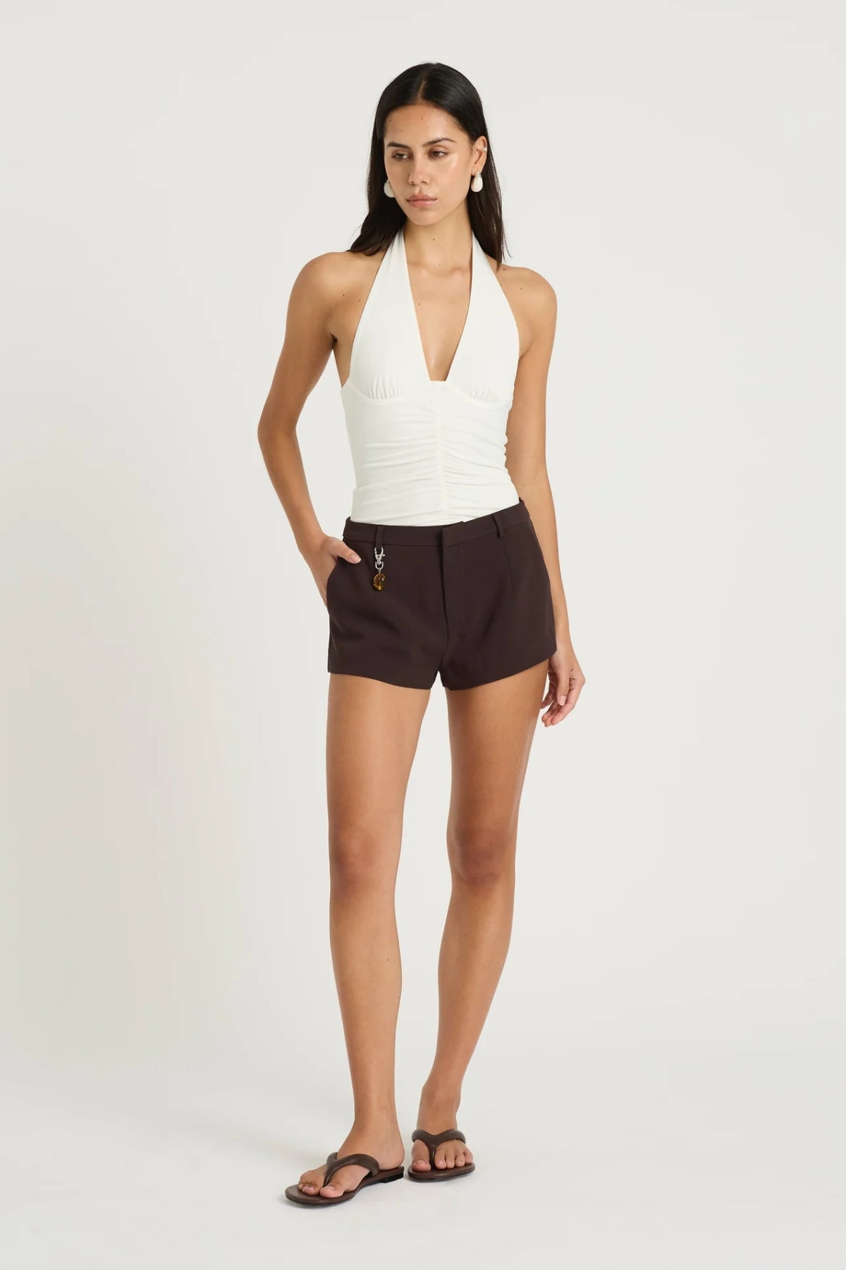 Joelle Micro Short Choc by Benni, tailored structured short with belt loops, pockets and a detachable stone bead pendant for an elevated finish.