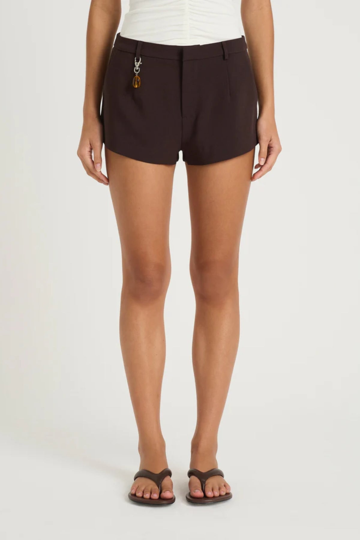Joelle Micro Short Choc by Benni, tailored structured short with belt loops, pockets and a detachable stone bead pendant for an elevated finish.