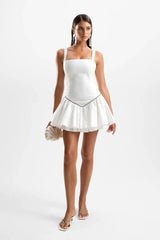 Juliette Mini Dress Pearl by Cin Cin – feminine white cotton mini with fitted bodice and layered tutu skirt, perfect for summer events.
