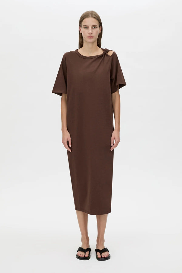 Juno Knot Tee Dress by Camilla and Marc — a chocolate cotton maxi with an asymmetric cut-out and draped knot detail for modern everyday wear.