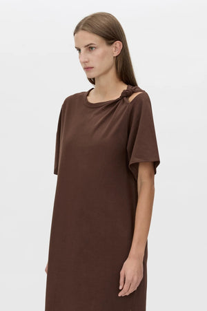 Juno Knot Tee Dress by Camilla and Marc — a chocolate cotton maxi with an asymmetric cut-out and draped knot detail for modern everyday wear.