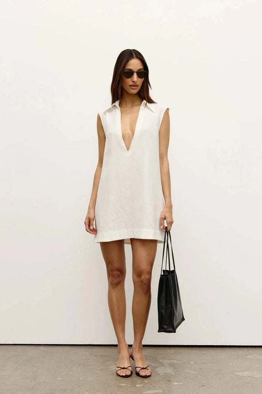 Juno Mini Dress by Bayse, a crisp white sleeveless mini with collared neckline and relaxed shift silhouette.