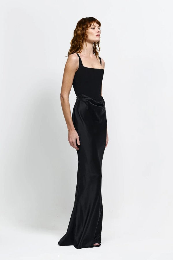 Keanna Gown in Black by Effie Kats, a structured square-neck gown with a draped cowl waist, blending crepe and satin for elegant eveningwear.