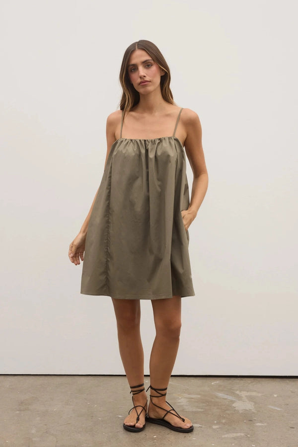 Kerrie Mini Dress in Ash by Bayse, a breezy cotton A-line mini with gathered neckline and pockets, perfect for summer days.