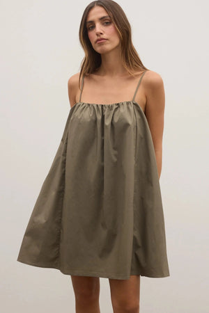 Kerrie Mini Dress in Ash by Bayse, a breezy cotton A-line mini with gathered neckline and pockets, perfect for summer days.