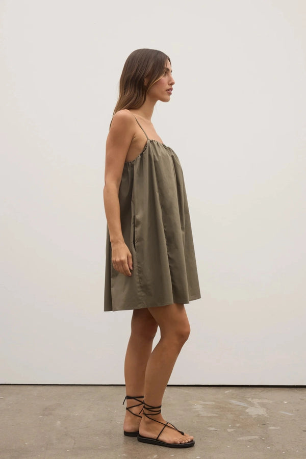 Kerrie Mini Dress in Ash by Bayse, a breezy cotton A-line mini with gathered neckline and pockets, perfect for summer days.