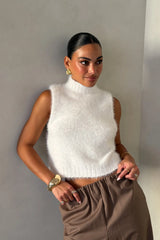Kiki Turtle Neck Knit Vest White by Sneaky Link – a sleeveless knit with high neckline and soft feel. Perfect for layering or styling.