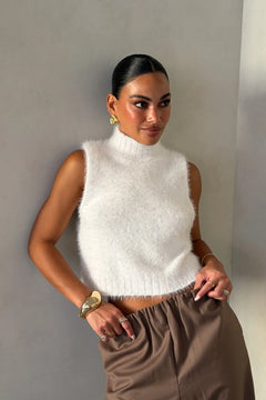 Kiki Turtle Neck Knit Vest White by Sneaky Link – a sleeveless knit with high neckline and soft feel. Perfect for layering or styling.