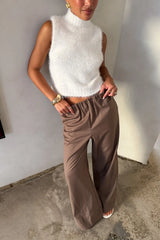 Kiki Turtle Neck Knit Vest White by Sneaky Link – a sleeveless knit with high neckline and soft feel. Perfect for layering or styling.