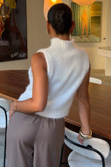 Kiki Turtle Neck Knit Vest White by Sneaky Link – a sleeveless knit with high neckline and soft feel. Perfect for layering or styling.