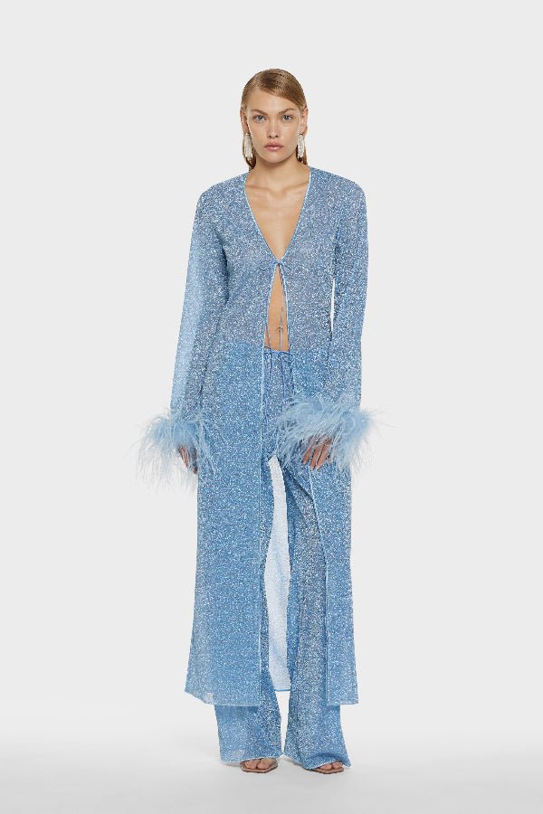 Lumière Pants Crystal by Oséree, elegant straight-leg pants in shimmering crystal blue metallic fabric. Lightweight with an elastic waistband, perfect for relaxed resort or evening wear.