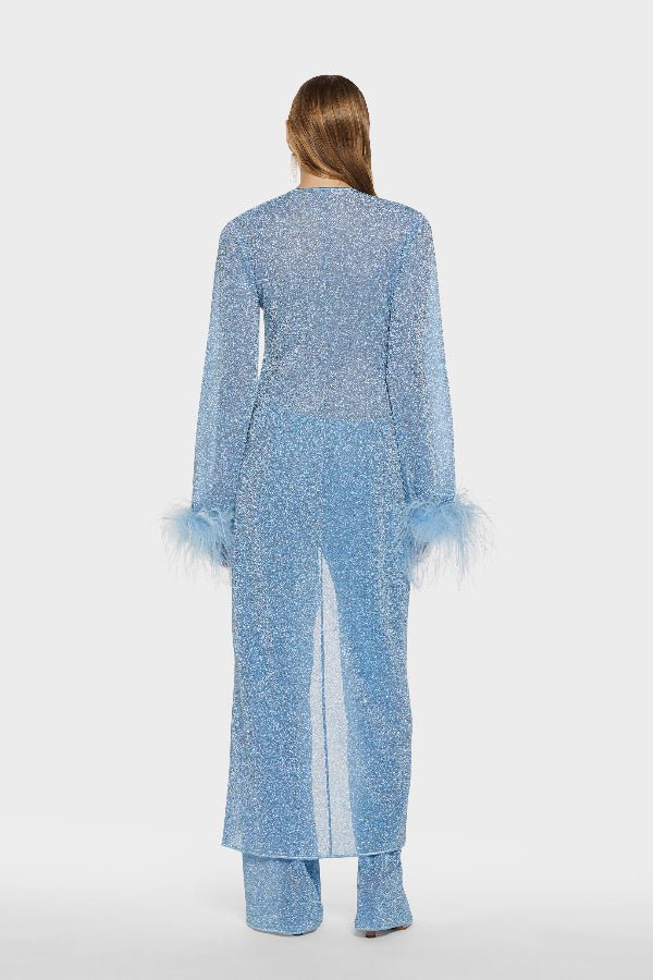 Lumière Pants Crystal by Oséree, elegant straight-leg pants in shimmering crystal blue metallic fabric. Lightweight with an elastic waistband, perfect for relaxed resort or evening wear.