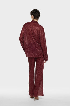 Lumière Pants Burgundy by Oséree, luxurious straight-fit pants in rich burgundy metallic fabric. Lightweight with an elastic waistband, perfect for day-to-night elegance.
