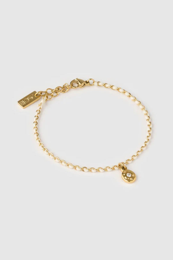 Lacey Bracelet Vanilla by Arms of Eve, minimalist rope bracelet with zircon charm in soft vanilla tones for a golden, playful summer touch.