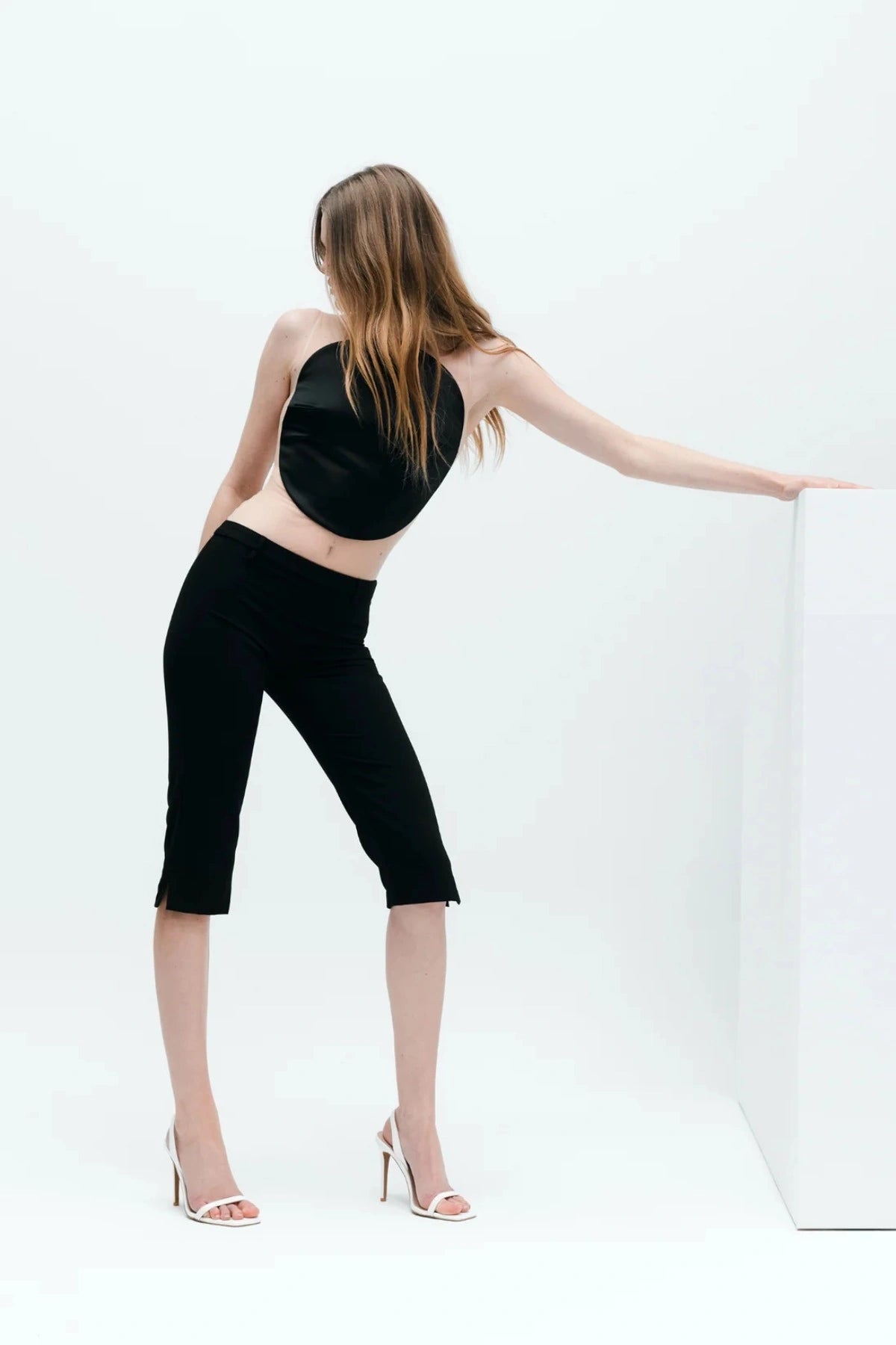 Lana Wilkinson Cassidy Sandal in white patent leather with slim stiletto heel and squared-off toe, perfect for party or summer wear.