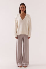 Lane Plunge Sweater Cream by Sovere, knit sweater with deep v neckline and relaxed fit. Perfect for cozy layering or everyday styling.