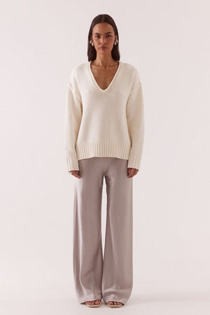 Lane Plunge Sweater Cream by Sovere, knit sweater with deep v neckline and relaxed fit. Perfect for cozy layering or everyday styling.