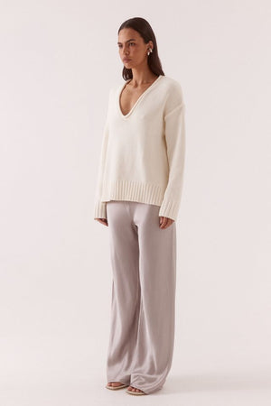 Lane Plunge Sweater Cream by Sovere, knit sweater with deep v neckline and relaxed fit. Perfect for cozy layering or everyday styling.