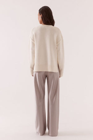 Lane Plunge Sweater Cream by Sovere, knit sweater with deep v neckline and relaxed fit. Perfect for cozy layering or everyday styling.
