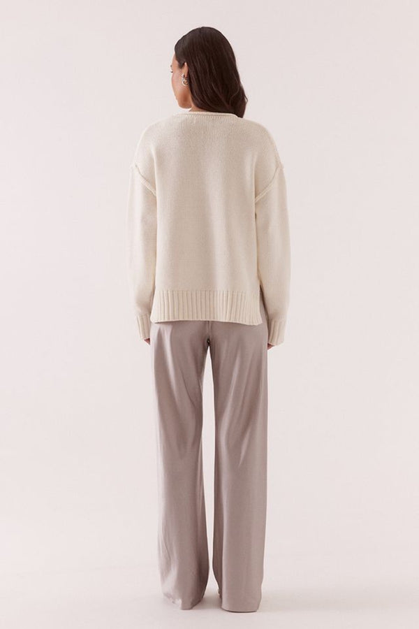 Lane Plunge Sweater Cream by Sovere, knit sweater with deep v neckline and relaxed fit. Perfect for cozy layering or everyday styling.
