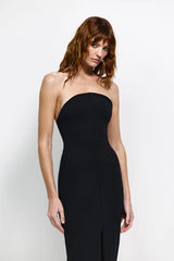 Lani Gown in Black by Effie Kats, a strapless floor-length stretch gown with curved neckline, cinched waist, and daring front split for statement elegance.