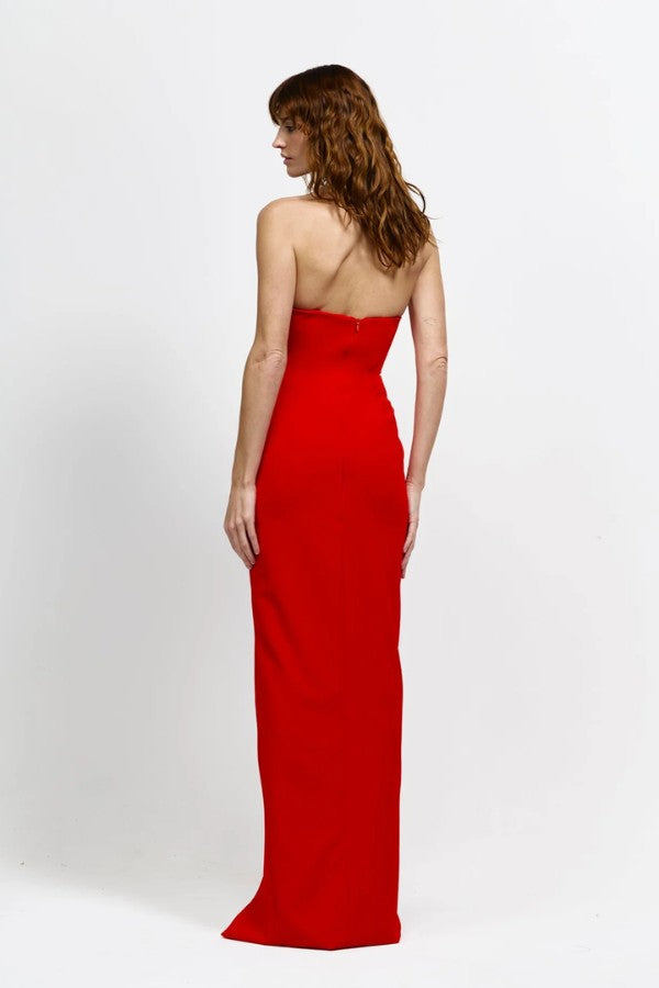 Lani Gown in Red by Effie Kats, a strapless floor-length gown with curved neckline, cinched waist, and bold front split for timeless evening elegance.