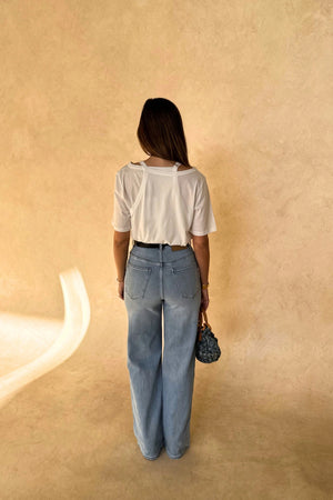 Layered Tee in White by Sneaky Link, 100% cotton with a relaxed fit and layered neckline detail. Perfect for elevated casual dressing.
