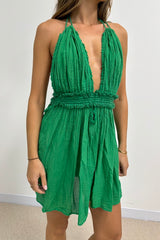 Lefkothea Mini Dress Green by D' Artemide – a halter mini with deep neckline and elastic waist. Perfect for summer styling.