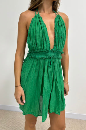 Lefkothea Mini Dress Green by D' Artemide – a halter mini with deep neckline and elastic waist. Perfect for summer styling.