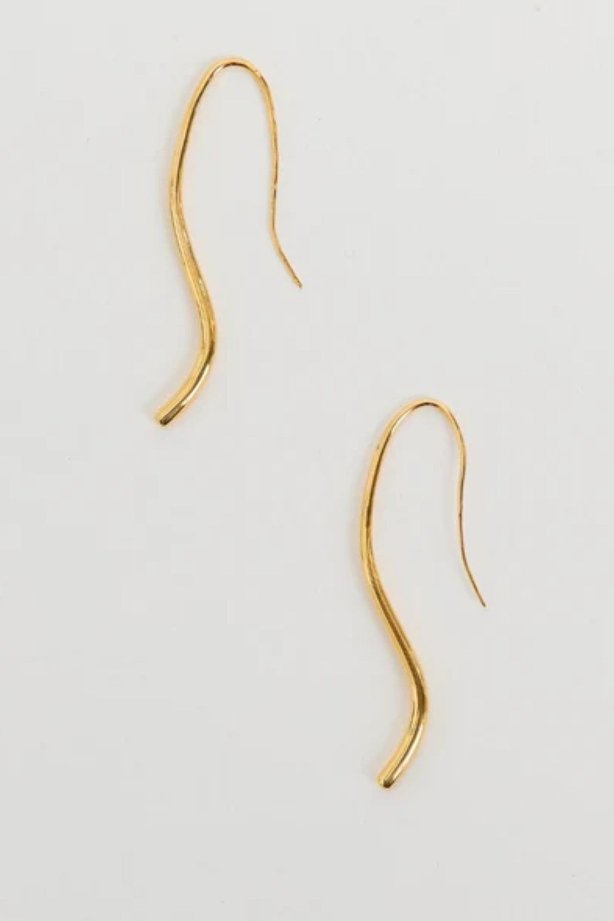 Lenora Earrings by Heaven Mayhem – gold fluid curved drop earrings that slip on without backings, perfect for refined everyday elegance.