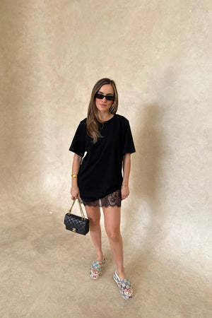 Lia Tee Black by Sneaky Link – Oversized 100% cotton boxy tee with short sleeves, perfect for layering or casual styling with denim.