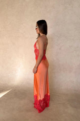 Lilah Maxi Dress in Orange by Sneaky Link, silk-lace maxi in vibrant tangerine with fluid drape and lace panels. Perfect for event dressing.
