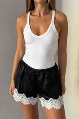 Lilah Short in black and ivory with a relaxed fit and mid-thigh length, featuring a subtle two-tone design.