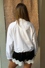 Lilah Short in black and ivory with a relaxed fit and mid-thigh length, featuring a subtle two-tone design.