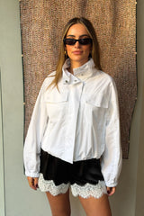Lilah Short in black and ivory with a relaxed fit and mid-thigh length, featuring a subtle two-tone design.
