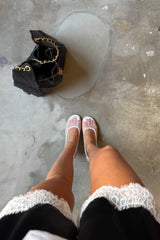 Lilah Short in black and ivory with a relaxed fit and mid-thigh length, featuring a subtle two-tone design.