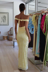 Lilou Dress Baby Yellow by Deconduarte – a sequin maxi with cowl neckline and fitted shape. Perfect for formal styling.