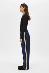 Locus Scuba Pant in Midnight by Camilla and Marc, a mid-rise scuba pant with side stripe detailing, pintuck legs, and zip hem finish.